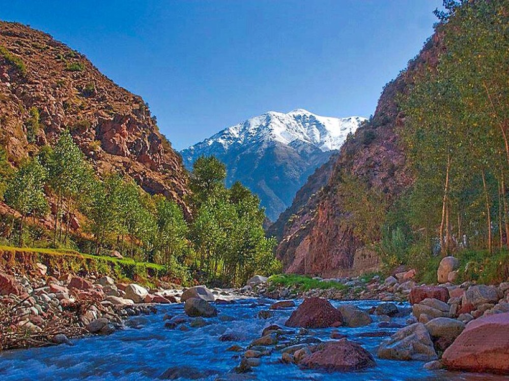 Ourika Valley cascading waterfalls with lush greenery and hiking trails